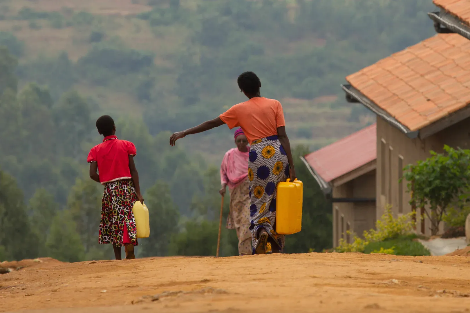 women in Africa walking to get water